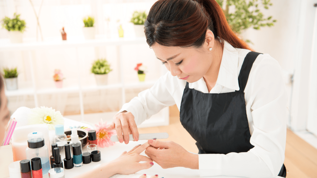 A woman using the best biotin for nails