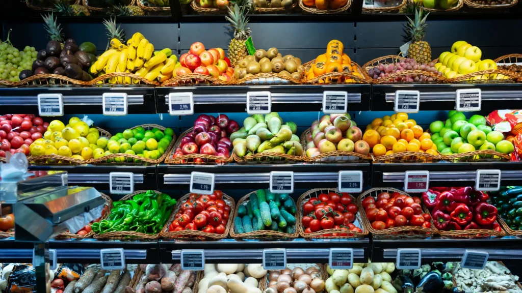 A bustling store brimming with vibrant, fresh fruits and vegetables, offering a healthy and colorful array of produce.
