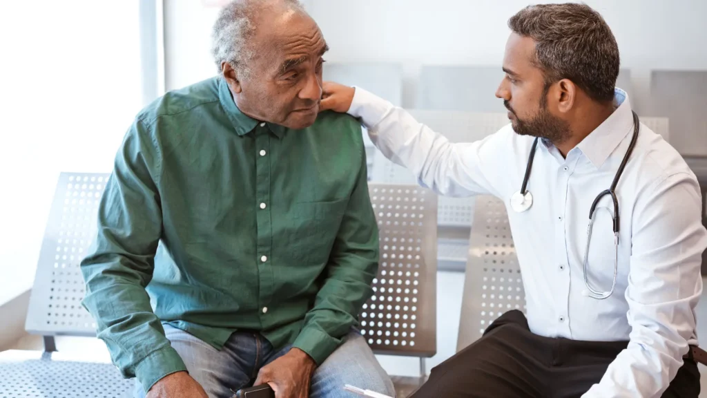 A doctor discussing medical concerns with an elderly patient.