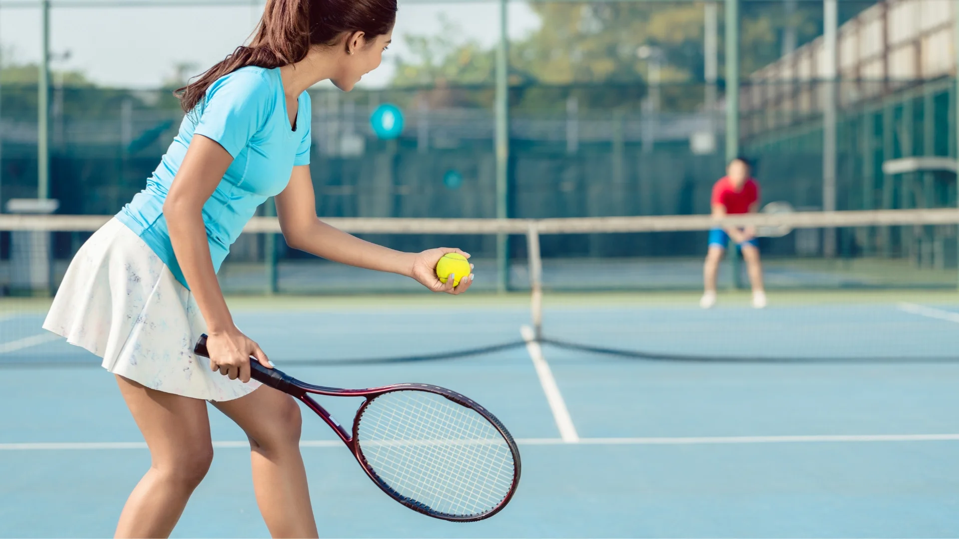A woman confidently holds a tennis racket and a ball, ready to play a thrilling game on the court. Motivation to Exercise