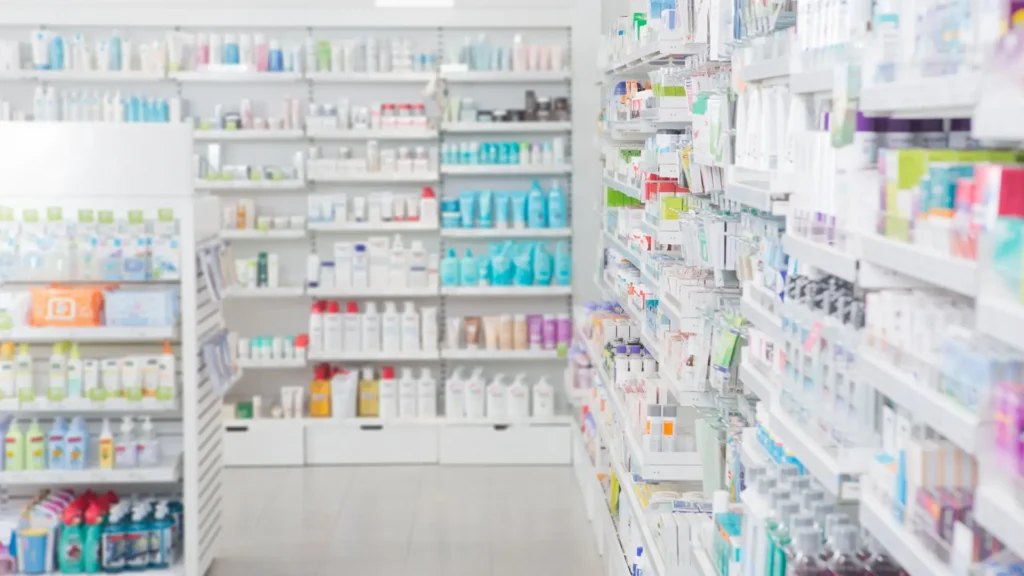 Pharmacy shelves display diverse products in a store.
