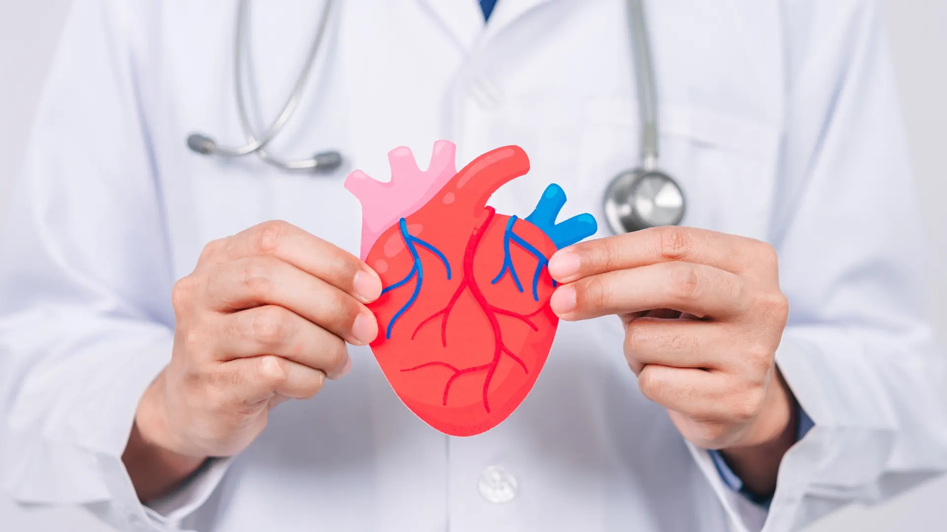 A doctor carefully holds a heart in his hands, demonstrating his expertise and dedication to saving lives.
