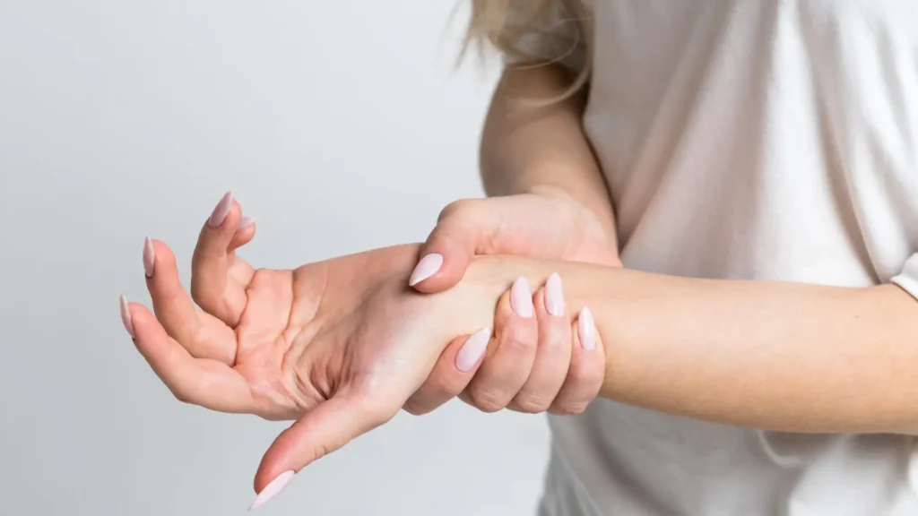 A woman checking her pulse with her hand.