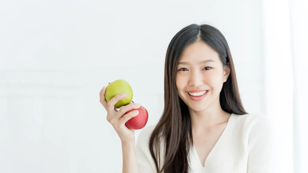 A lady eating apples