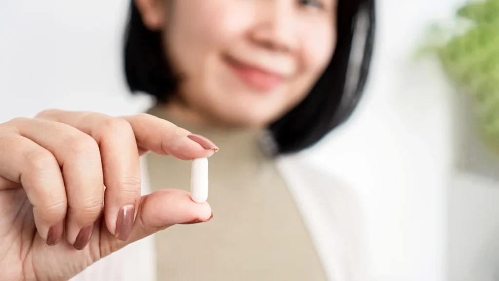 A woman holding the best eye supplements for diabetics