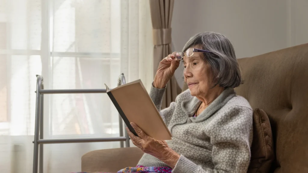 An old lady reading the best books about dementia