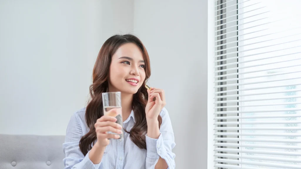 A young woman eating the Best Hyaluronic Acid Supplements