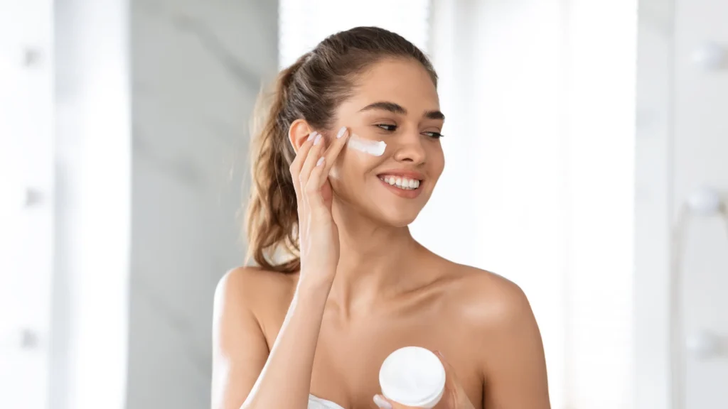 A woman using the Best Hyaluronic Acid Moisturizer for Mature Skin