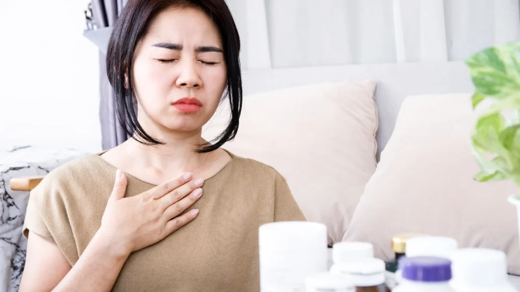 A woman using the Best Over the Counter Nausea Medicine