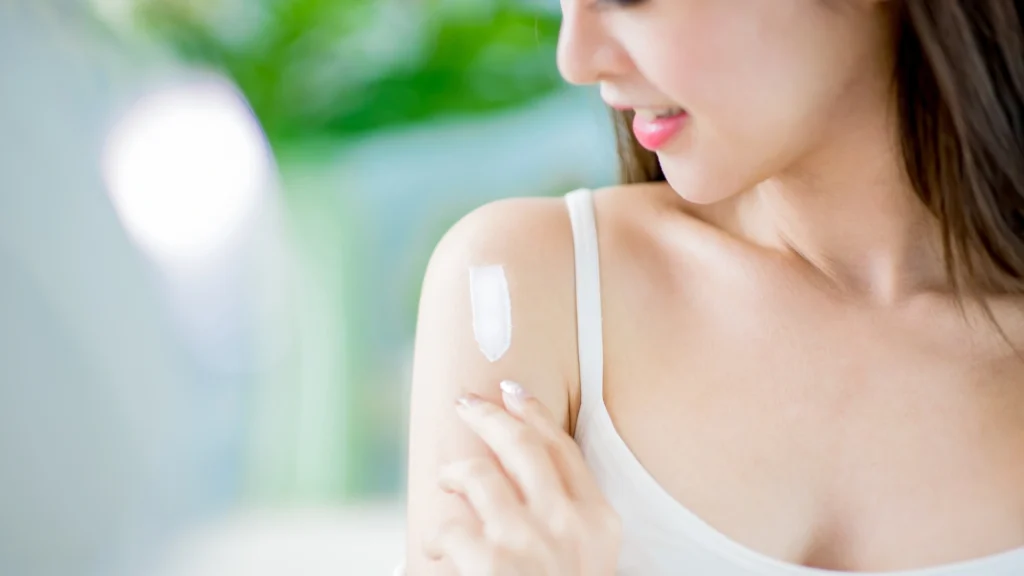 A woman using the Best Zinc Oxide Sunscreen for Face