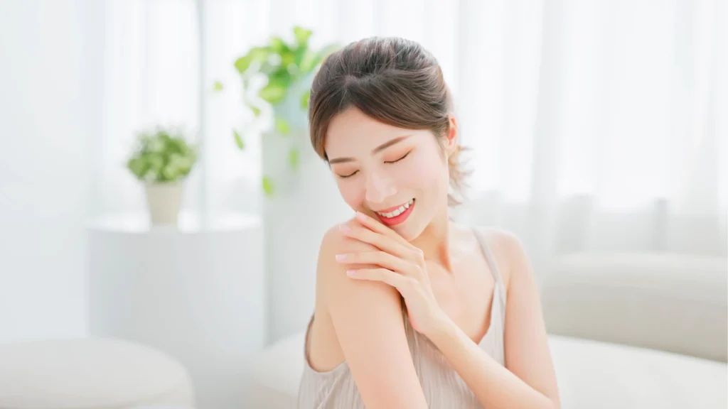 A woman enjoying the best hydrating face mask for flights