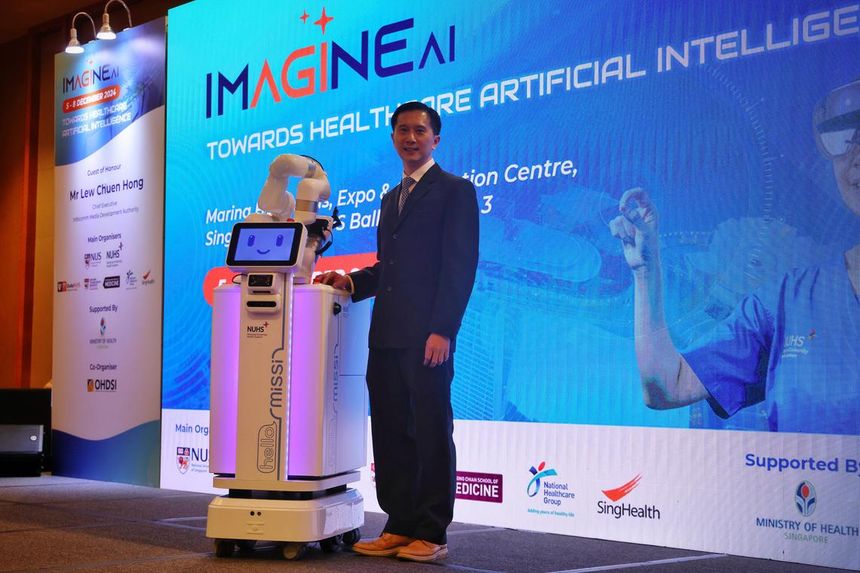 Robot Nurses in Singapore? NUS Adjunct Professor Ngiam Kee Yuan posing with the Missi robot at the Imagine AI 2024 healthtech conference at Marina Bay Sands on Dec 5.