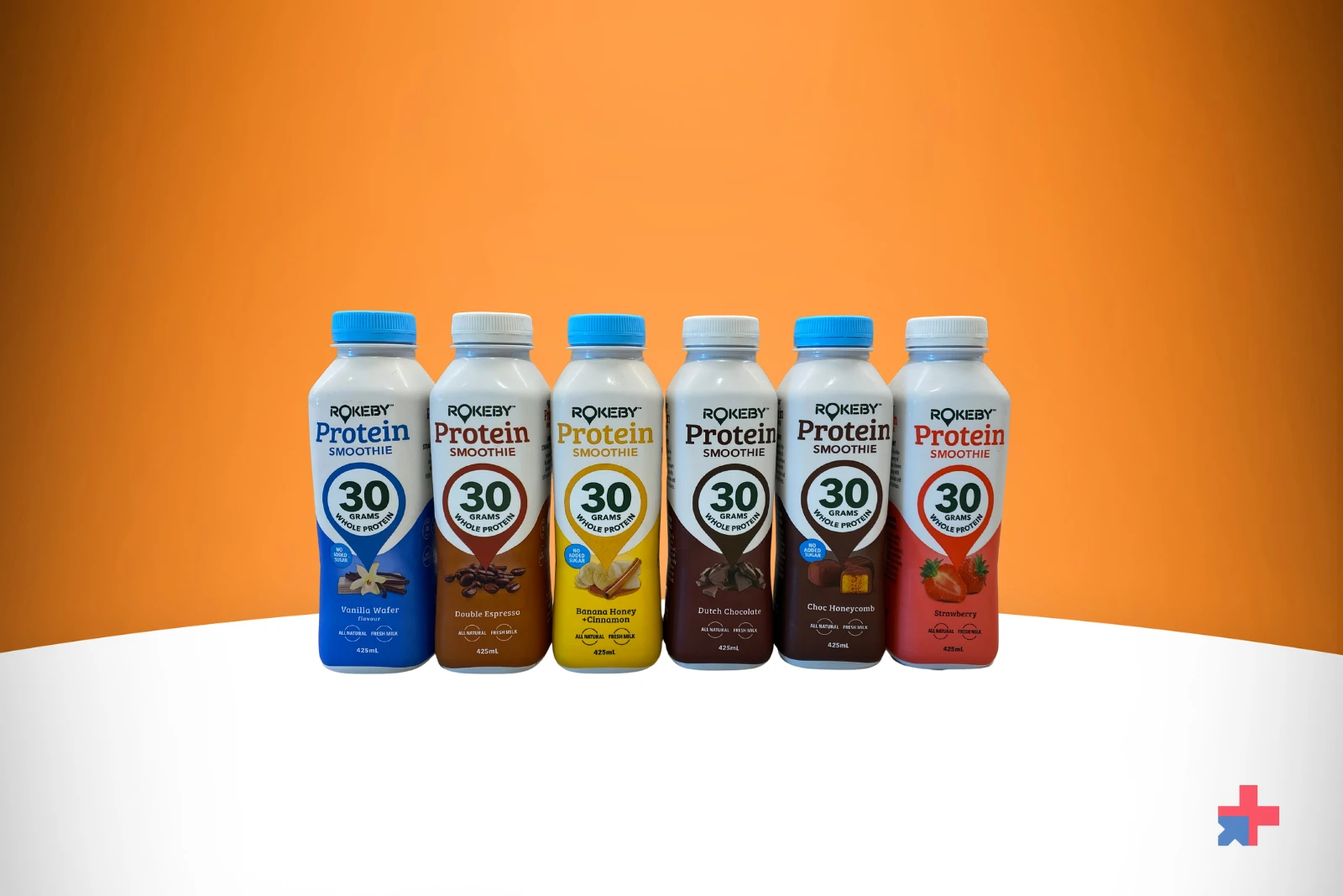 Six bottles of Rokeby Protein Smoothie in different flavors stand in a row.